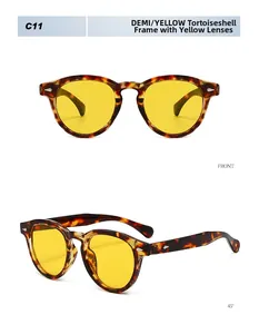 Detail of retro round tortoise frames with yellow lenses and silver diamond rivets