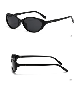 Detail view of retro cat-eye sunglasses featuring silver rivets and polished black frame
