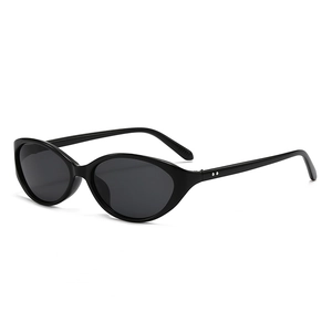 Retro black cat-eye sunglasses with oval frames and silver metal stud accents