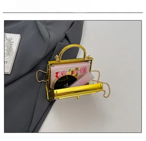 Interior capacity display of acrylic mini bag showing lipstick and small wallet inside