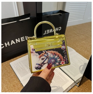 Mini acrylic Kelly bag with a golden mirror finish and painted horse art head detail