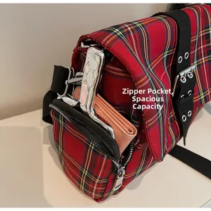 Detail of red plaid tote bag zipper pocket showing large capacity with accessories