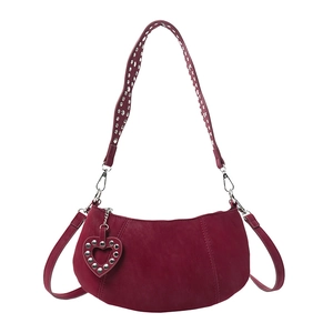 Burgundy matte half-moon shoulder bag with silver studs and a heart pendant charm