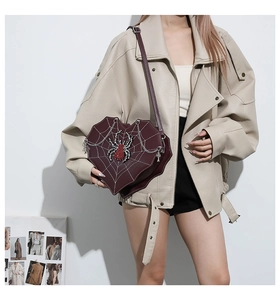 Gothic heart-shaped crossbody bag featuring white spider web stitching and spider detail