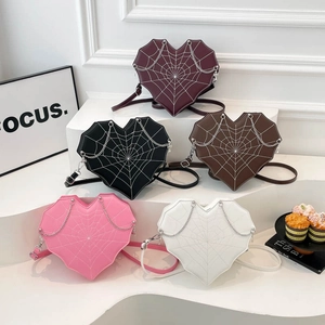 Heart-shaped crossbody bag with spider web stitching and silver chain in five colors