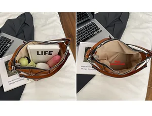 Detailed interior of the brown bucket bag showing the main pocket with everyday essentials