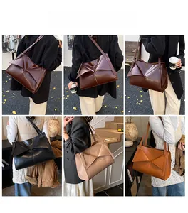 Foto lifestyle della borsa tote vintage in pelle con dettagli geometrici per l'uso quotidiano