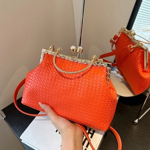 Orange woven evening clutch with pearl clasp and sparkling diamond-studded handle