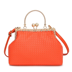 Orange woven leather evening bag with golden metal frame, pearl clasp and chain strap