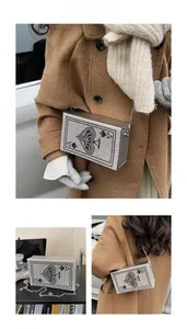 Silver rhinestone box clutch with Ace of Spades poker pattern and metal chain strap