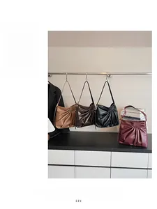 Detail showing high-capacity ruched tote bags in brown, coffee, black and burgundy colors