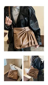 Detailed view of brown ruched tote bag showing fine pleated texture and logo detail