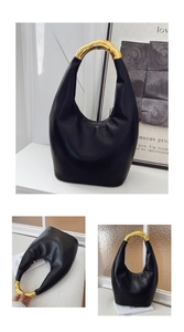 Dettaglio borsa Hobo in pelle nera con manico in metallo dorato a forma di bambù e zip