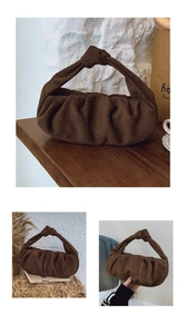 Detail of dark brown suede dumpling bag featuring unique knotted strap and pleated texture