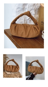 Close-up of caramel suede pleated dumpling bag featuring a decorative knot handle detail
