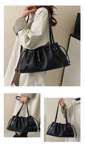 Detail of black lychee grain leather tote bag featuring pleated drawstring and floral charm