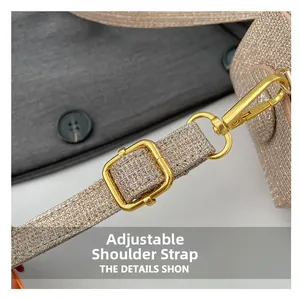 Detail of glitter texture shoulder strap with adjustable gold buckle and metal clasp