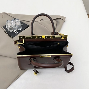 Retro deep red-brown leather doctor bag with gold hardware shown at a 45-degree angle