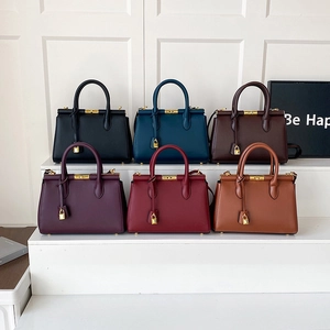 Classic leather commuter handbags in six colors with gold hardware and top handle design