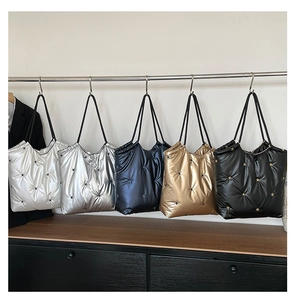 Quilted puffer tote bags in five metallic colors featuring star-pattern stitching details