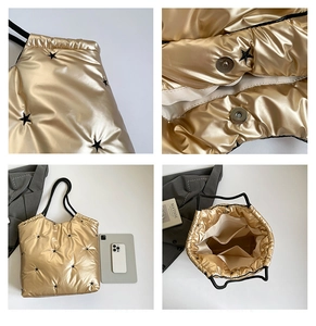 Detail view of champagne gold quilted tote bag with star embroidery and inner pockets