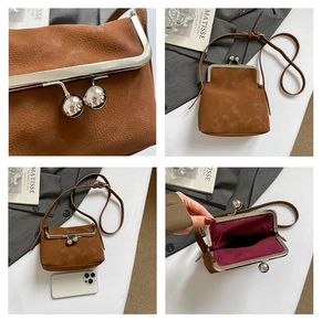 Detail showing brown lychee leather mini bag with silver ball clasp and phone scale