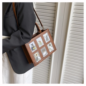 Detail of tarot cat print on brown tote bag with shoulder strap for daily commuting