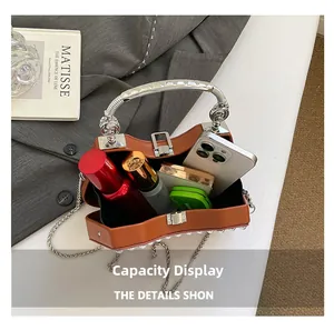 Interior view of vintage box bag showing capacity for phone and cosmetics