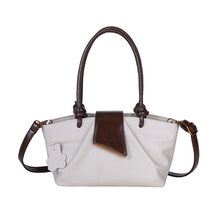 Chic beige leather pleated handbag with brown handles and adjustable crossbody strap
