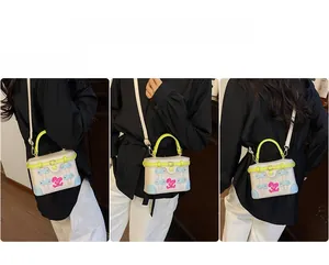 Contrast color box bag shown in front, side, and back views on model with shoulder strap