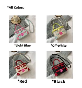 Detail of colorful mini box bag with cute rabbit charm and metallic lock design