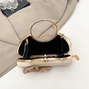 Elegant beige evening box bag with golden ring handle and floral pleat decoration