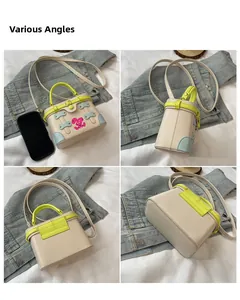 Mini box handbag with pink rabbit print and contrast neon yellow handle from various angles