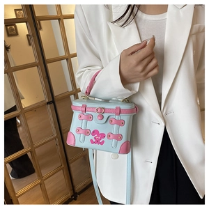 Blue box handbag featuring pink leather trim and a cute cartoon rabbit print with bow