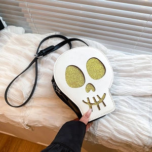 Quirky white skull shaped crossbody bag with gold glitter details and black strap