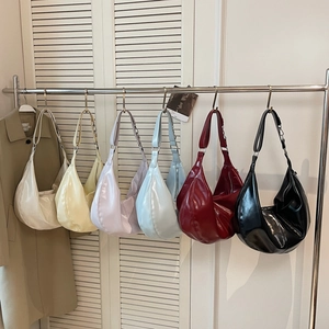 Glossy patent leather hobo bags in various colors with elegant chain straps for women