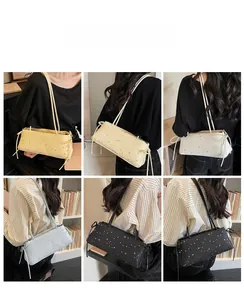Chic star pattern shoulder bag with side bow detail in multiple colors on a model
