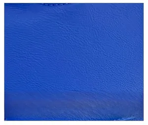 Macro shot of dark blue leather texture with fine embossed patterns on a retro punk bag