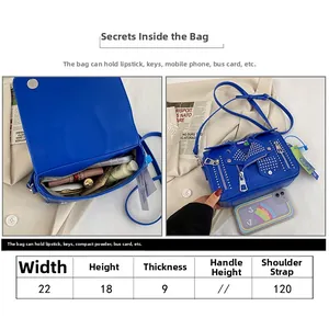 Size chart for bright blue jacket-style shoulder bag with rivets and metal zippers