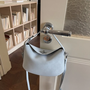 Light blue minimalist dumpling handbag in matte leather with silver hardware lock
