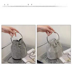 Detail view of two rhinestone bucket bags with silver metal handles and drawstring closure