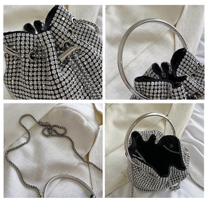 Detailed views of silver rhinestone bucket bag with metal handle and chain strap