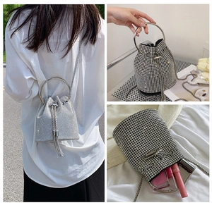 Detailed views of a silver rhinestone bucket bag with drawstring and metal ring handle