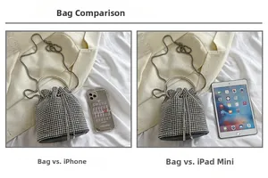 Size comparison of silver rhinestone bucket bag with iPhone and iPad mini on white fabric