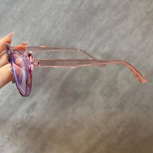 Detail of pink transparent cat-eye glasses frame with model GA8802 on the temple