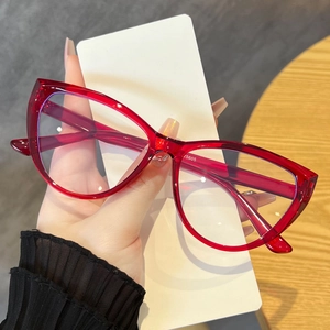 Macro detail of wine red cat eye glasses frame showing high-quality texture and blue light lens