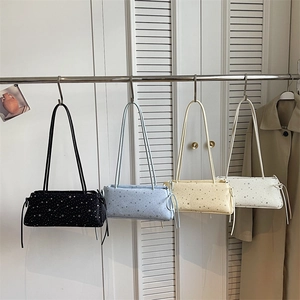 Minimalist star-print baguette shoulder bag in black, blue, yellow, and cream white