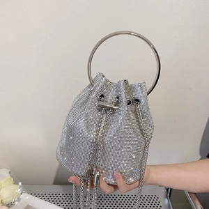 Sparkling silver rhinestone bucket bag with metal ring handle and drawstring chain strap