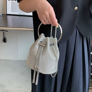 Chic silver rhinestone drawstring bucket bag with metal handle and elegant chain strap