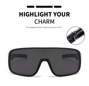 Detail view of large shield sunglasses with glossy black frame and metal hinge design